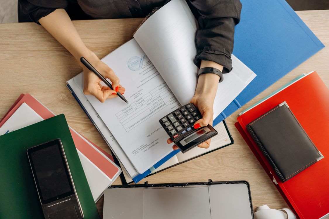 Financial documents arranged on a work desk